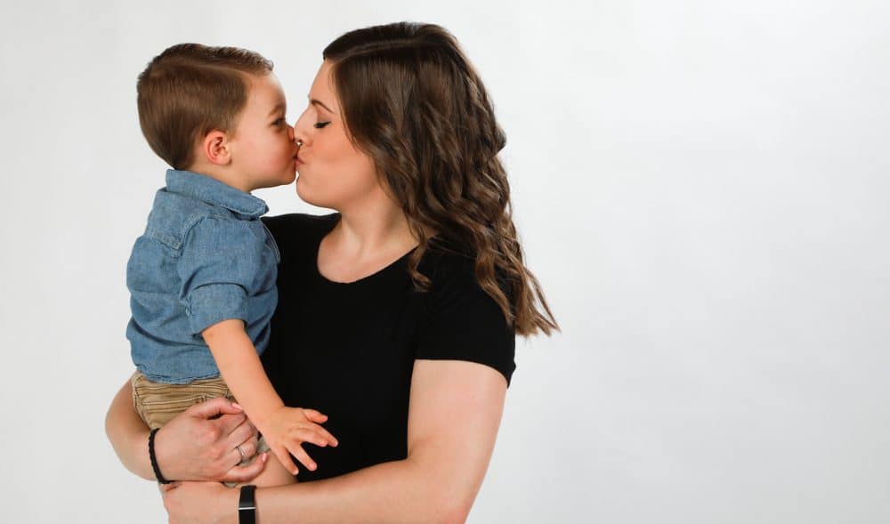 Mom giving her son some love.